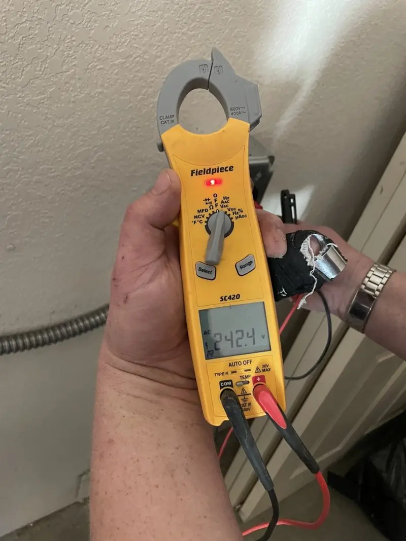 Voltage testing with clamp meter during Generator Installation in Bradenton